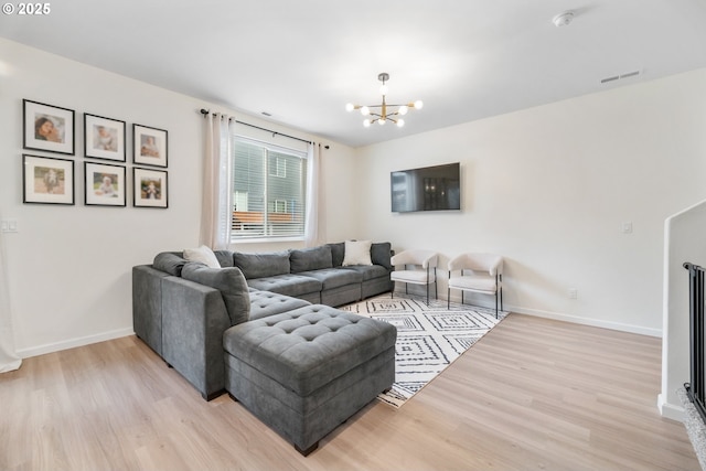 3563 SE Richey Rd, Gresham, OR 97080 - living room with wood finished floors, a chandelier, and baseboards