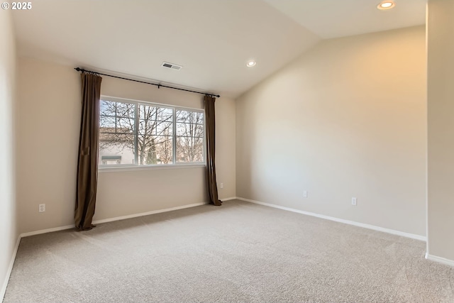 carpeted empty room with lofted ceiling, baseboards, visible vents, and recessed lighting