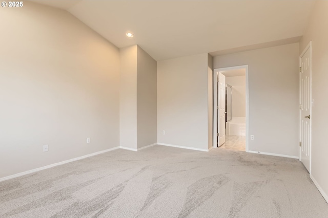 unfurnished room with light carpet, baseboards, vaulted ceiling, and recessed lighting