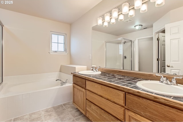 bathroom with a garden tub, a sink, visible vents, and a shower stall