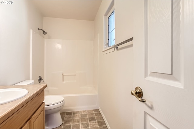 full bathroom featuring washtub / shower combination, vanity, and toilet