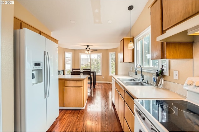 15619 NE Hickory St, Vancouver, WA 98682 - kitchen featuring white appliances, wood finished floors, light countertops, and decorative light fixtures