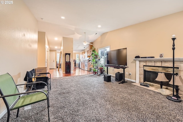 15619 NE Hickory St, Vancouver, WA 98682 - living area featuring vaulted ceiling, ceiling fan, a tiled fireplace, and recessed lighting