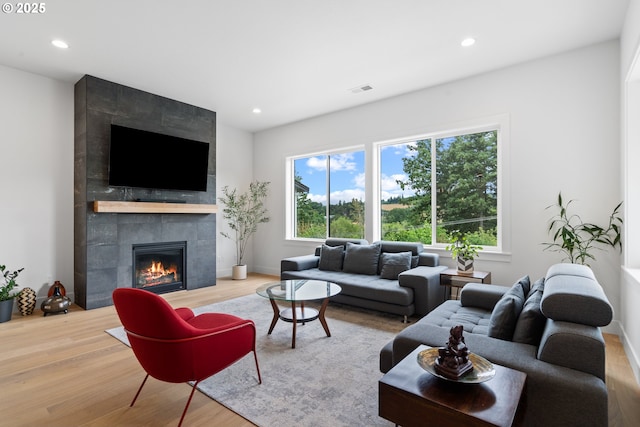 15625 NW Gooderham St, Portland, OR 97229 - living area with wood finished floors, a tile fireplace, and recessed lighting