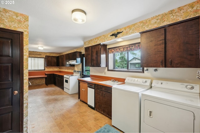28040 SE Stark St, Troutdale, OR 97060 - kitchen with white range with electric cooktop, washer and dryer, dark brown cabinetry, a sink, and light countertops