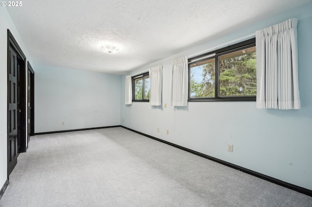 28040 SE Stark St, Troutdale, OR 97060 - unfurnished room featuring a textured ceiling, light colored carpet, and baseboards