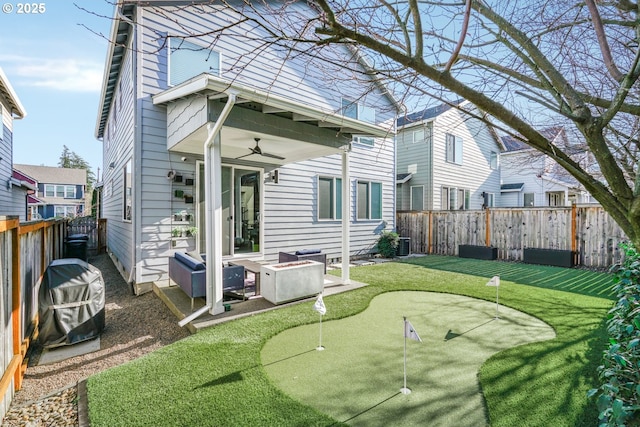 rear view of property with a lawn