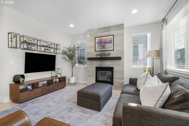 living room with a tiled fireplace