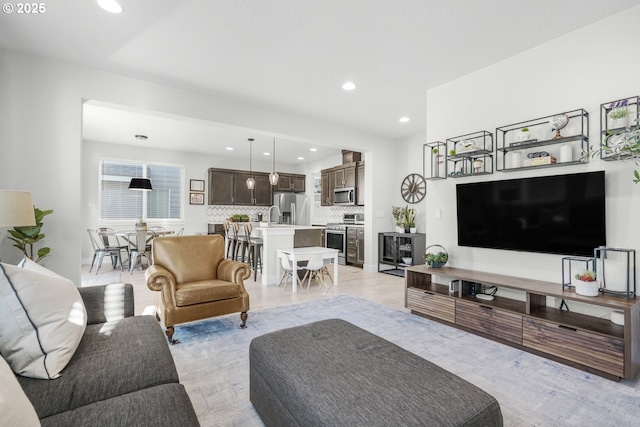 living room with light hardwood / wood-style floors