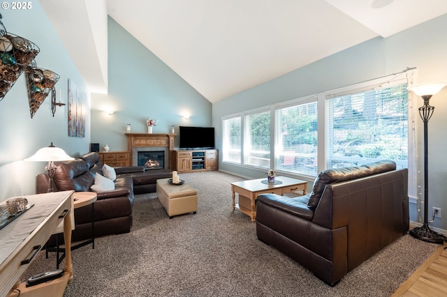 16420 SW Sienna Ln, Beaverton, OR 97007 - living room featuring high vaulted ceiling, a glass covered fireplace, and wood finished floors