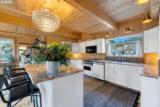 53461 Safe Rd, Bandon, OR 97411 - kitchen with beam ceiling, a sink, white cabinetry, white appliances, and wood ceiling