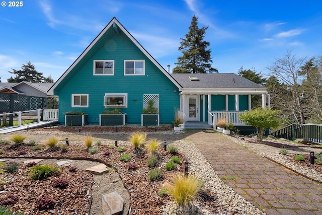 53461 Safe Rd, Bandon, OR 97411 - view of front of home featuring fence and covered porch