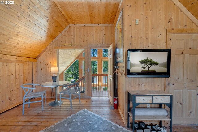 53461 Safe Rd, Bandon, OR 97411 - bonus room with lofted ceiling, wooden ceiling, wood walls, and hardwood / wood-style flooring