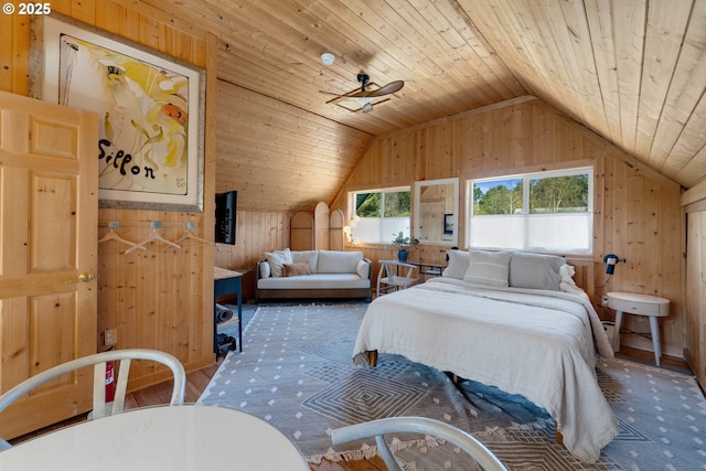 53461 Safe Rd, Bandon, OR 97411 - carpeted bedroom featuring baseboards, wooden walls, lofted ceiling, and wood ceiling