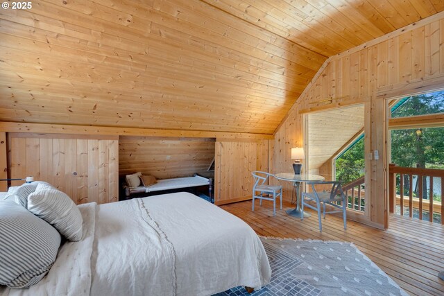 53461 Safe Rd, Bandon, OR 97411 - bedroom featuring lofted ceiling, wood walls, access to exterior, wooden ceiling, and wood-type flooring