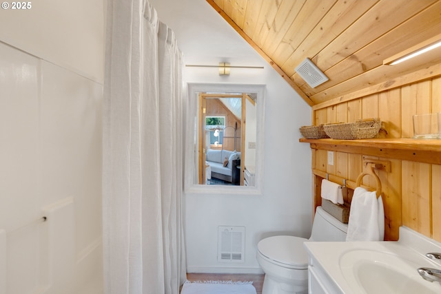53461 Safe Rd, Bandon, OR 97411 - bathroom with lofted ceiling, visible vents, toilet, and wood ceiling