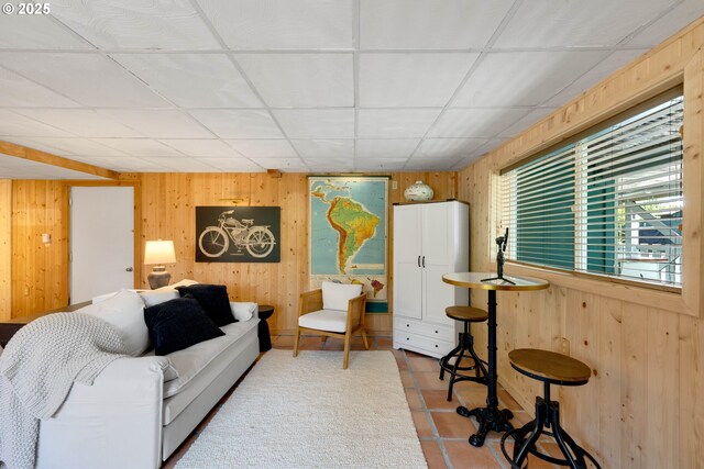 53461 Safe Rd, Bandon, OR 97411 - living room featuring a paneled ceiling and wood walls