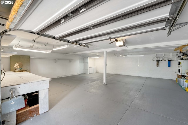 53461 Safe Rd, Bandon, OR 97411 - garage with water heater and a garage door opener