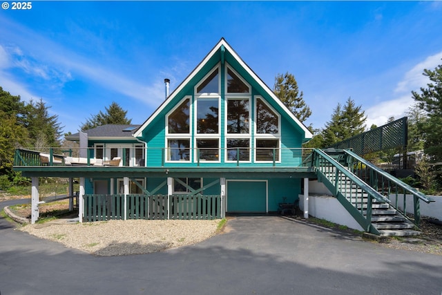 53461 Safe Rd, Bandon, OR 97411 - view of front facade featuring stairway, driveway, and a garage