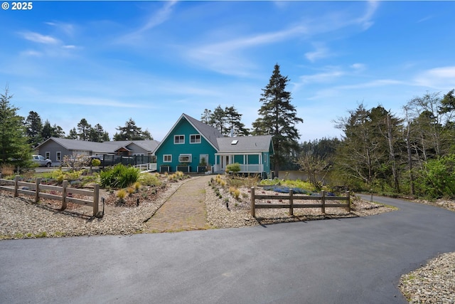 53461 Safe Rd, Bandon, OR 97411 - view of front facade with fence and aphalt driveway