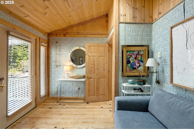53461 Safe Rd, Bandon, OR 97411 - living area featuring wood ceiling, wallpapered walls, vaulted ceiling, and wood finished floors