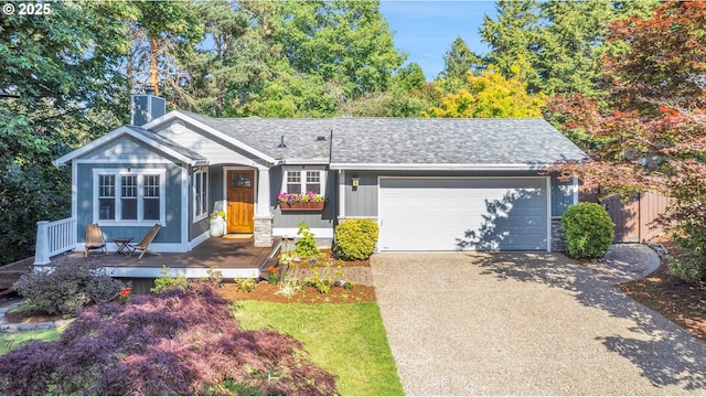 21482 SW 92nd Ct, Tualatin, OR 97062 - view of front of property featuring driveway, an attached garage, a chimney, and roof with shingles