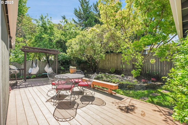 21482 SW 92nd Ct, Tualatin, OR 97062 - wooden terrace with a fenced backyard and outdoor dining area