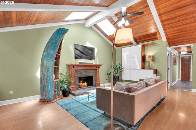 21482 SW 92nd Ct, Tualatin, OR 97062 - living area with wood finished floors, a skylight, baseboards, a ceiling fan, and wooden ceiling