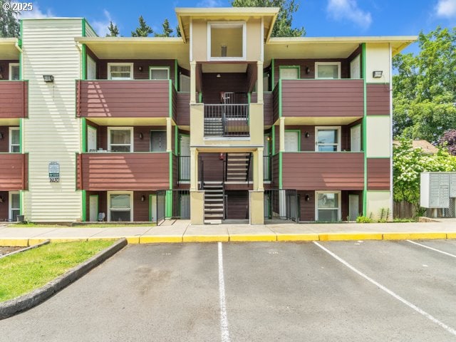 9257 SE Clinton St, Portland, OR 97266 - view of building exterior featuring uncovered parking