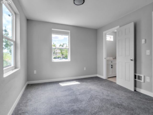 9257 SE Clinton St, Portland, OR 97266 - unfurnished bedroom featuring carpet flooring and baseboards