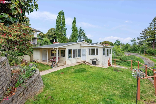 500 State St, North Bend, OR 97459 - rear view of house with a lawn, a patio, and entry steps