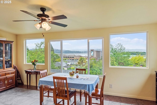 500 State St, North Bend, OR 97459 - dining room with baseboards and a ceiling fan