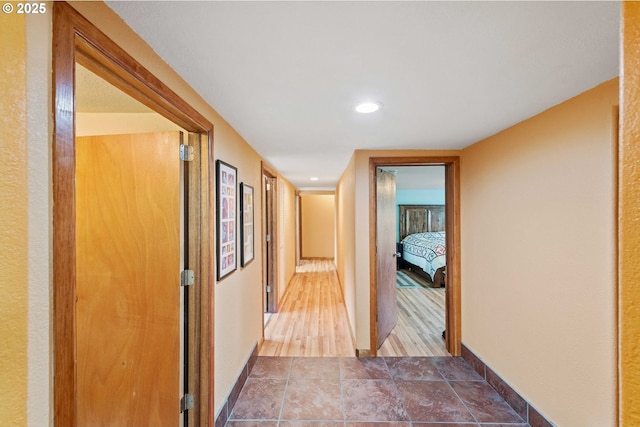 500 State St, North Bend, OR 97459 - hallway featuring recessed lighting, baseboards, and wood finished floors
