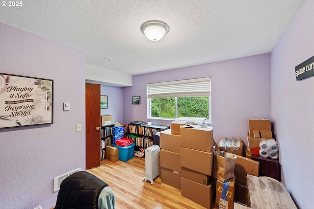 500 State St, North Bend, OR 97459 - interior space with light wood-type flooring and a textured ceiling