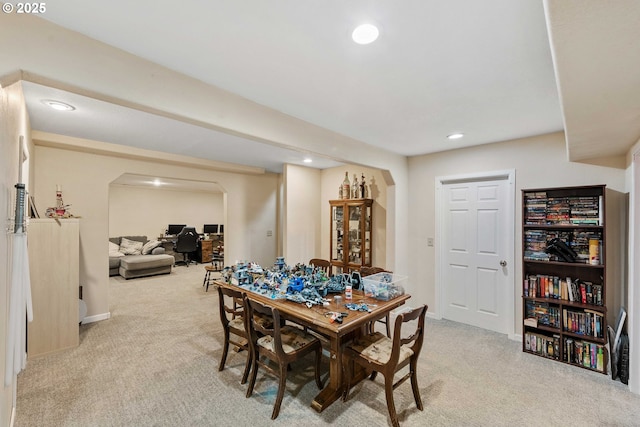 500 State St, North Bend, OR 97459 - dining area featuring arched walkways, light carpet, recessed lighting, and baseboards