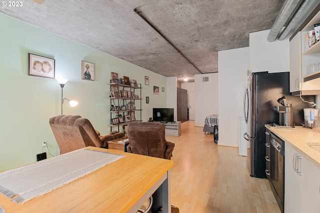 dining space with light hardwood / wood-style flooring