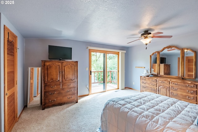 11874 Riverhaven Ln, Stayton, OR 97383 - bedroom featuring access to exterior, a textured ceiling, light colored carpet, baseboards, and ceiling fan