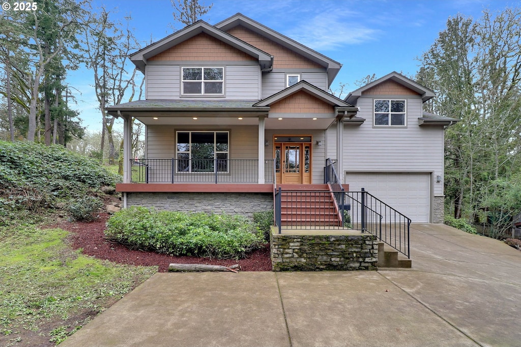 view of front of property with a garage and a porch