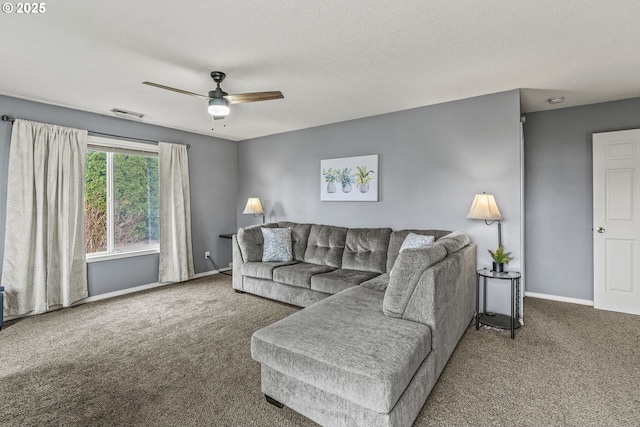 carpeted living area with ceiling fan, a textured ceiling, visible vents, and baseboards