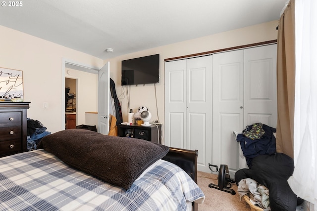 bedroom featuring light carpet and a closet