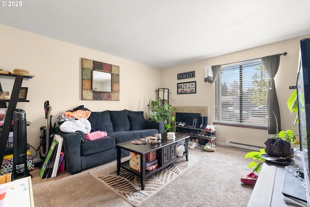 living area featuring a baseboard heating unit, carpet, a fireplace, and baseboards