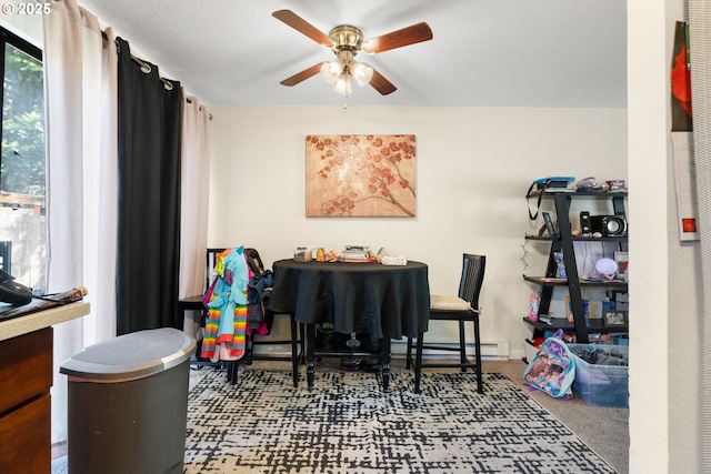 carpeted dining room featuring a ceiling fan