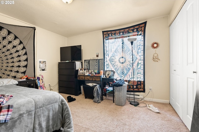 bedroom featuring carpet flooring and baseboards