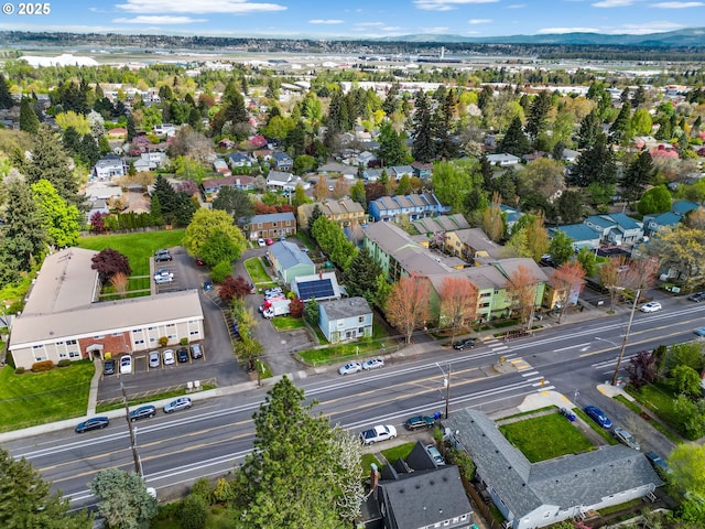 birds eye view of property with a residential view