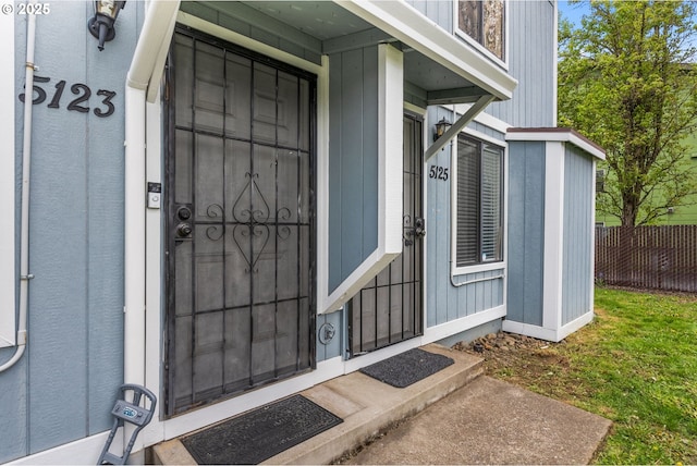 property entrance with fence