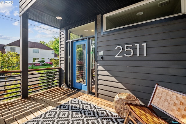 doorway to property featuring a porch