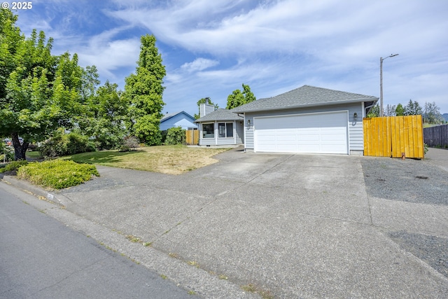 7324 B St, Springfield, OR 97478 - view of front of house featuring driveway, a garage, and a shingled roof