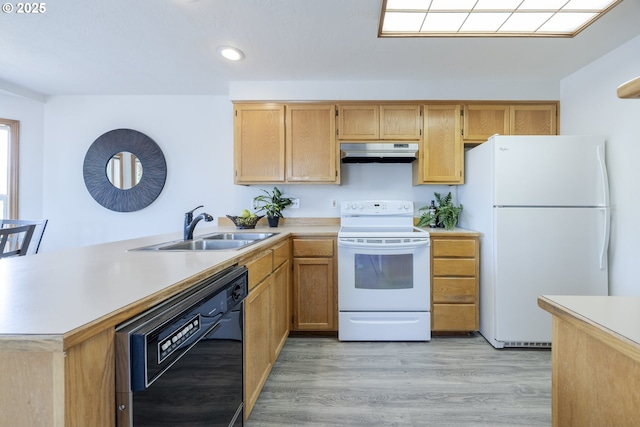 7324 B St, Springfield, OR 97478 - kitchen featuring white appliances, under cabinet range hood, light countertops, a peninsula, and recessed lighting