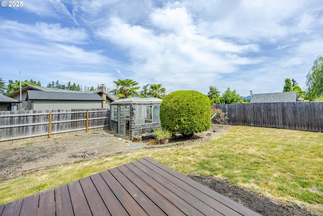 7324 B St, Springfield, OR 97478 - wooden terrace featuring an exterior structure, a fenced backyard, and an outbuilding