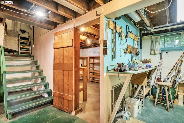 912 Van Buren St, Eugene, OR 97402 - below grade area featuring a workshop area and stairs